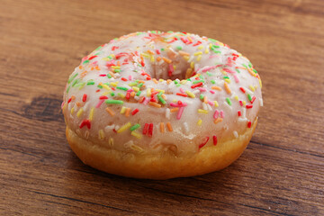 Sweet glazed vanilla donut with icing