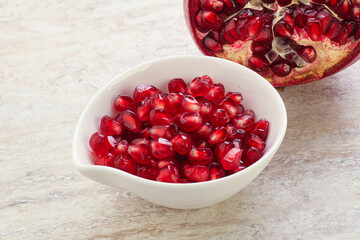 Ripe red Pomegranate seeds in the bowl