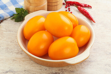 Sweet ripe yellow tomato in the bowl