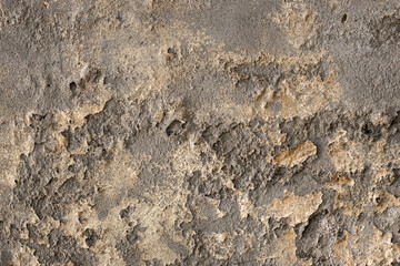 Distressed old cement plaster wall surface with rough texture for background