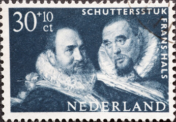 Netherlands - circa 1962: a postage stamp from the Netherlands , showing the portraits of historically dressed men from "Meal of the St. Georg Officers" (detail) by Frans Hals