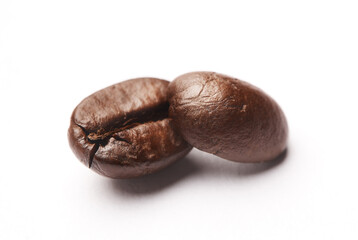 Keep calm and drink coffee. Studio shot of coffee beans against a white background.