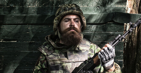 Close up portrait face of ukrainian soldier in army. Russian military forces, military game.