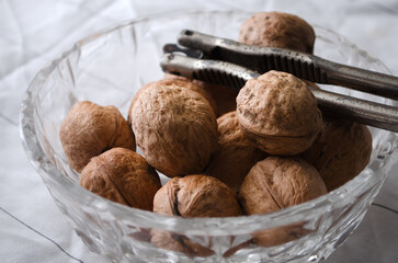 Cleaning walnuts. Walnut with a tool for peeling from the shell