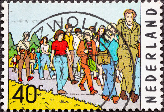 Netherlands - circa 1976 : a postage stamp from the Netherlands, showing a crowd at the 60th Four Day March, Nijmegen
