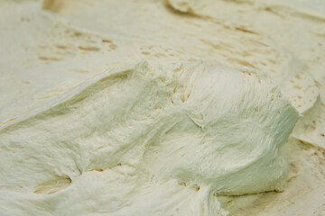 Raw dough for baking. Production of bakery products at the factory.