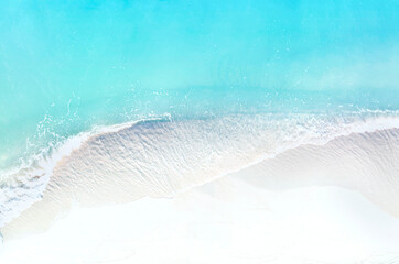 The turquoise wave water background at the seashore of the tropical Caribbean beach  with  sand beach Background