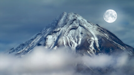 And the moon. A photo of the full moon over volcano.