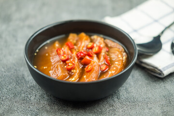 Pickled pieces of raw salmon in marinated shoyu