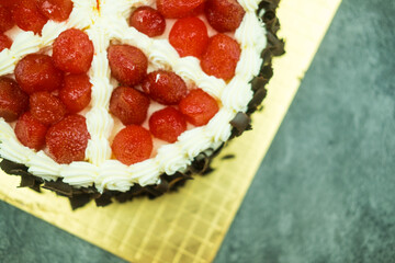 Tasty vanilla cake on top with strawberry