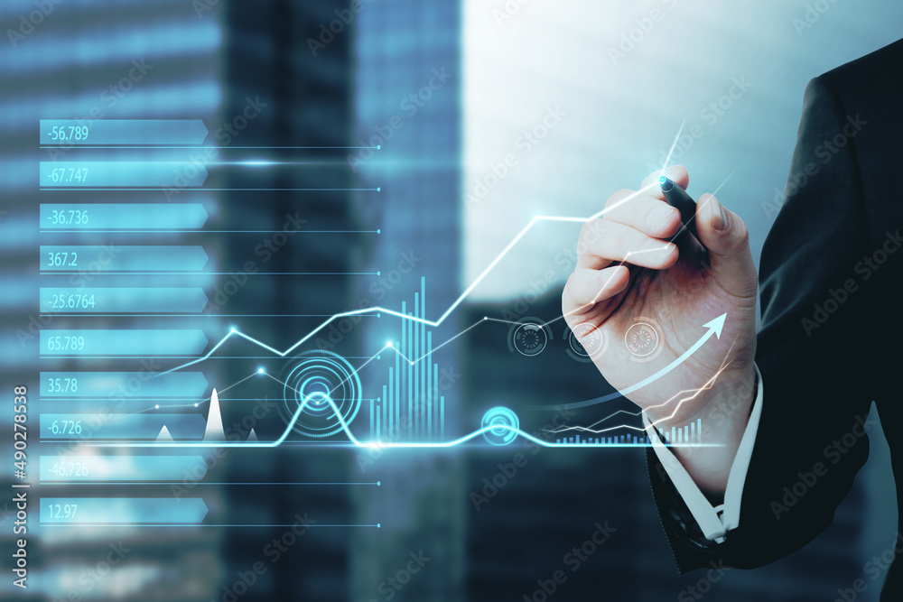Poster close up of hand with pen pointing at abstract business chart hologram on blurry city background. da