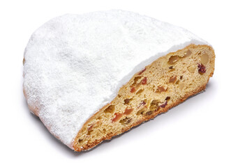 Sliced Traditional Christmas stollen cake with marzipan and dried fruit isolated on white background