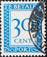 Netherlands - circa 1947: a postage stamp from the Netherlands , showing a number with an...