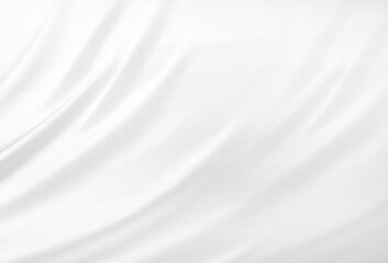 Fototapeta na wymiar Close up of white silk textured cloth background. Smooth elegant white silk or satin luxury cloth texture can use as wedding background. Luxurious background design. White fabric texture background.