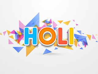 Indian festival of colours, colourful Happy Holi text with colourful triangle shapes abstract against white backgroud.
