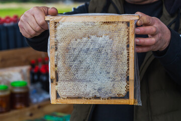 Closeup natural honey in comb.Texture background and pattern section of wax honeycomb from bee hive