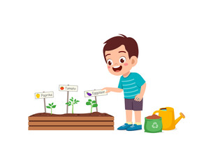 Obraz na płótnie Canvas cute little boy take care of vegetable plant