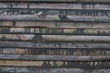 Close-up of wooden painted boards stacked tightly on top of each other
