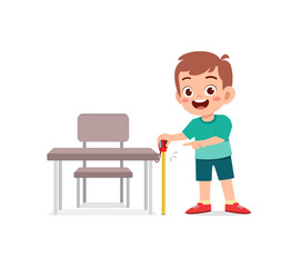 boy holding measure tape and check length of table