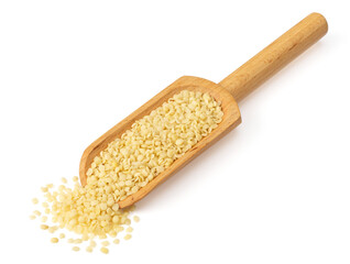 Hulled hemp seeds in the wooden scoop, isolated on the white background.
