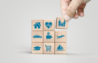 Wooden blocks with icons of various types of insurance. Life insurance concept.