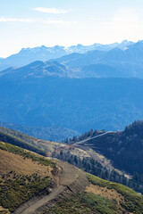 Beautiful mountain landscapes with peaks and valleys against a clear blue sky