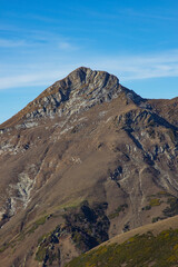 Beautiful mountain landscapes with peaks and valleys against a clear blue sky