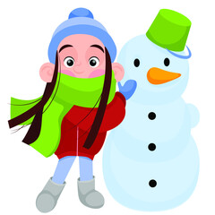 A girl in a green scarf makes a snowman