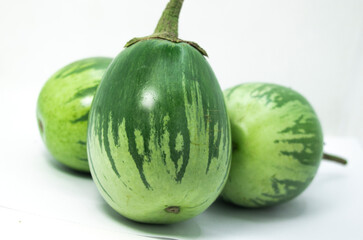 Healthy and delicious three eggplants on white background