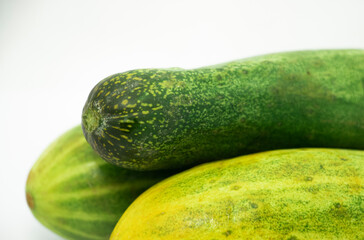 Raw fresh green cucumbers isolated on a white background