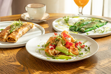 traditional Russian pastries: pancakes for Maslenitsa, pancakes with salmon, pancakes with honey, pancakes for breakfast