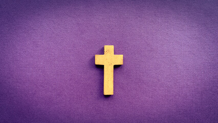 Cross on purple color cover. Christianity concept