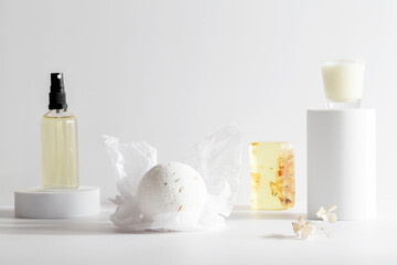 bath bomb, handmade soap, oil and candle on podium on white background. Still life, relax, wellness...