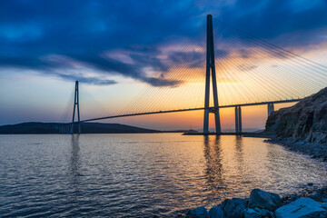 Obraz premium Sunset view of long cable-stayed bridge in Vladivostok, Far East of Russia
