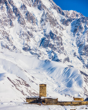 Old Lamaria church and rocky slopes of Shkhara mountain in Ushguli, Svaneti region, Georgia