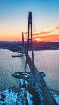 Winter aerial view of sunset over famous cable-stayed bridge from Vladivostok to Russky Island, Far East of Russia