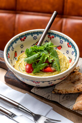 Eggplant caviar garnished with fresh herbs and pastries