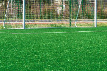 soccer gates. Football goal at the stadium. Football field with artificial lawn. Concept other party of soccer.  At stadium.