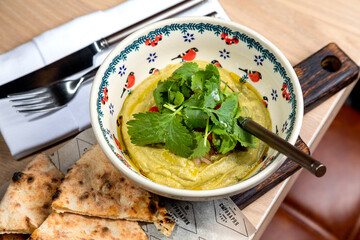 Eggplant caviar garnished with fresh herbs and pastries