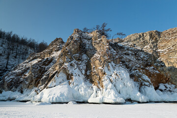 Frosty rocks covered by ice in the baikal lake shore, Siberia