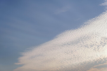 white clouds clustered in the sky, ray of light, copy space