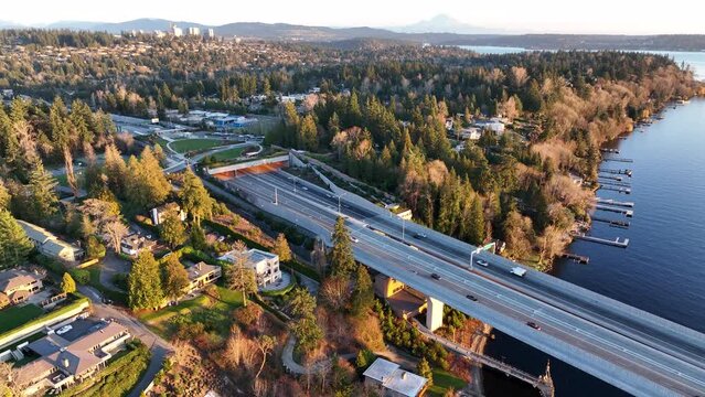 Cinematic aerial drone orbit footage of Medina, Hunts Point, Yarrow Point, Clyde Hill, Evergreen Point floating bridge, Bellevue, Lake Washington mansions, luxury homes, villas