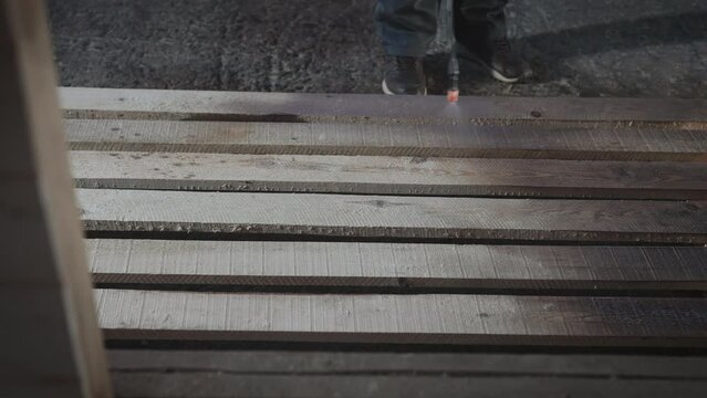 Treatment of wood with an antiseptic.