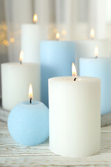 Fototapeta na wymiar Concept of relaxation with aroma candles, close up