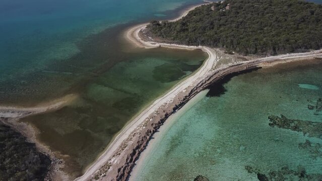 Natural Mediterranean lagoon with crystal blue sea filmed from the air, 4K drone footage in Dugi otok, Croatia