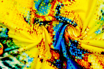 Close up detail of multi colored carnival costume fabric