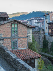 Small town of stone houses with the mountains behind in the north of Spain