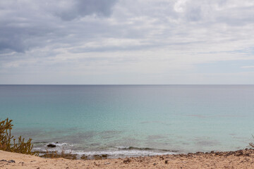 Impressive beaches of dunes and rocks with turquoise water on the island of Fuerteventura