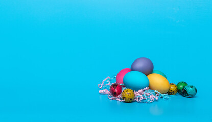 multi-colored easter eggs on a blue background