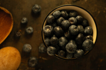 Black Berries in a Bowl on a Wood Table